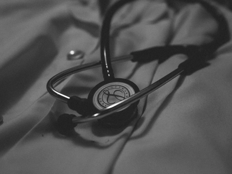 a stethoscope resting on the ground in a bed