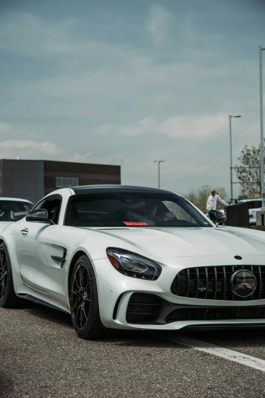 two sports cars sitting in a parking lot