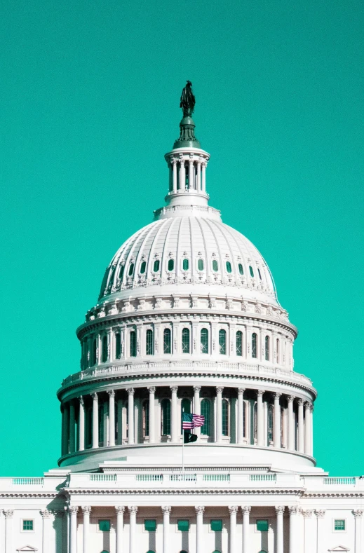 a large white building with a green sky behind it