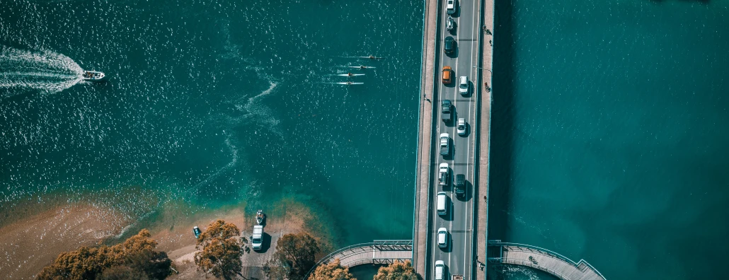 the street in the aerial s is near a boat dock