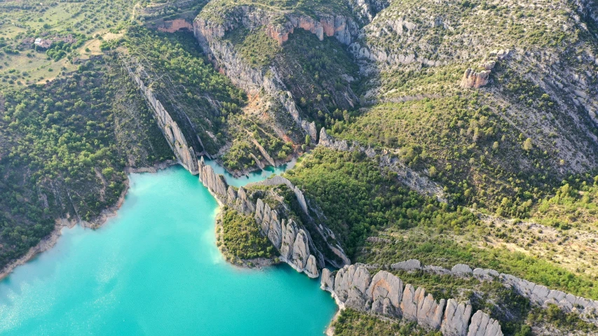 a river surrounded by rocks and lush greenery