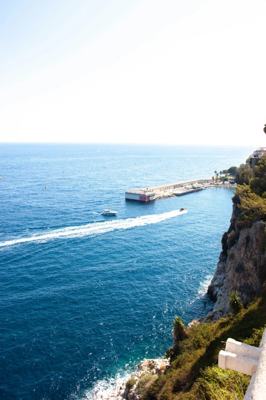 a large barge coming down the side of a cliff by the ocean