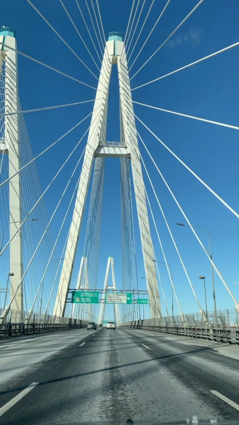 a very large bridge with cars traveling on it