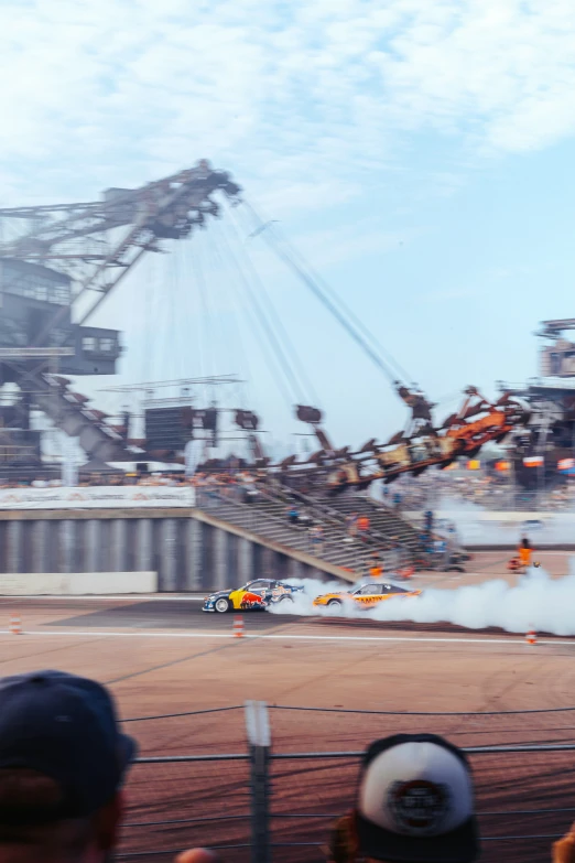 a race car driving around a pit during a race