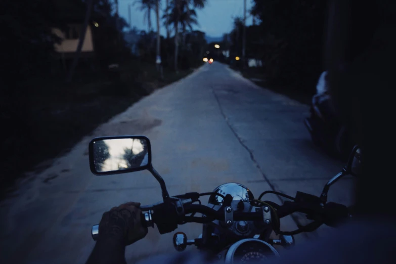 a street is shown at night while the lights on