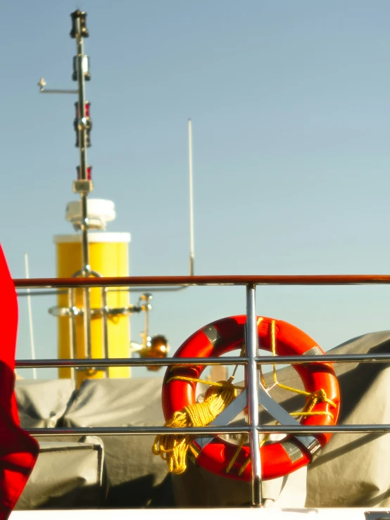 the life preserver on a boat with an ocean in background