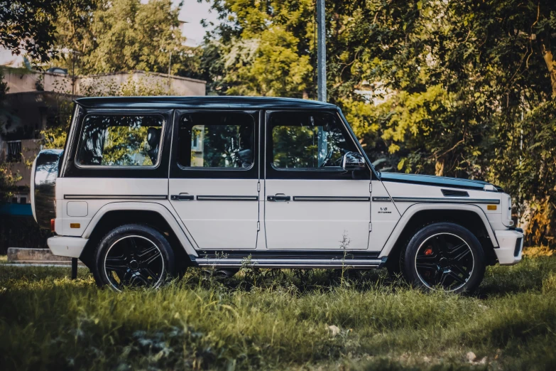 an off - road, classic car parked at the roadside