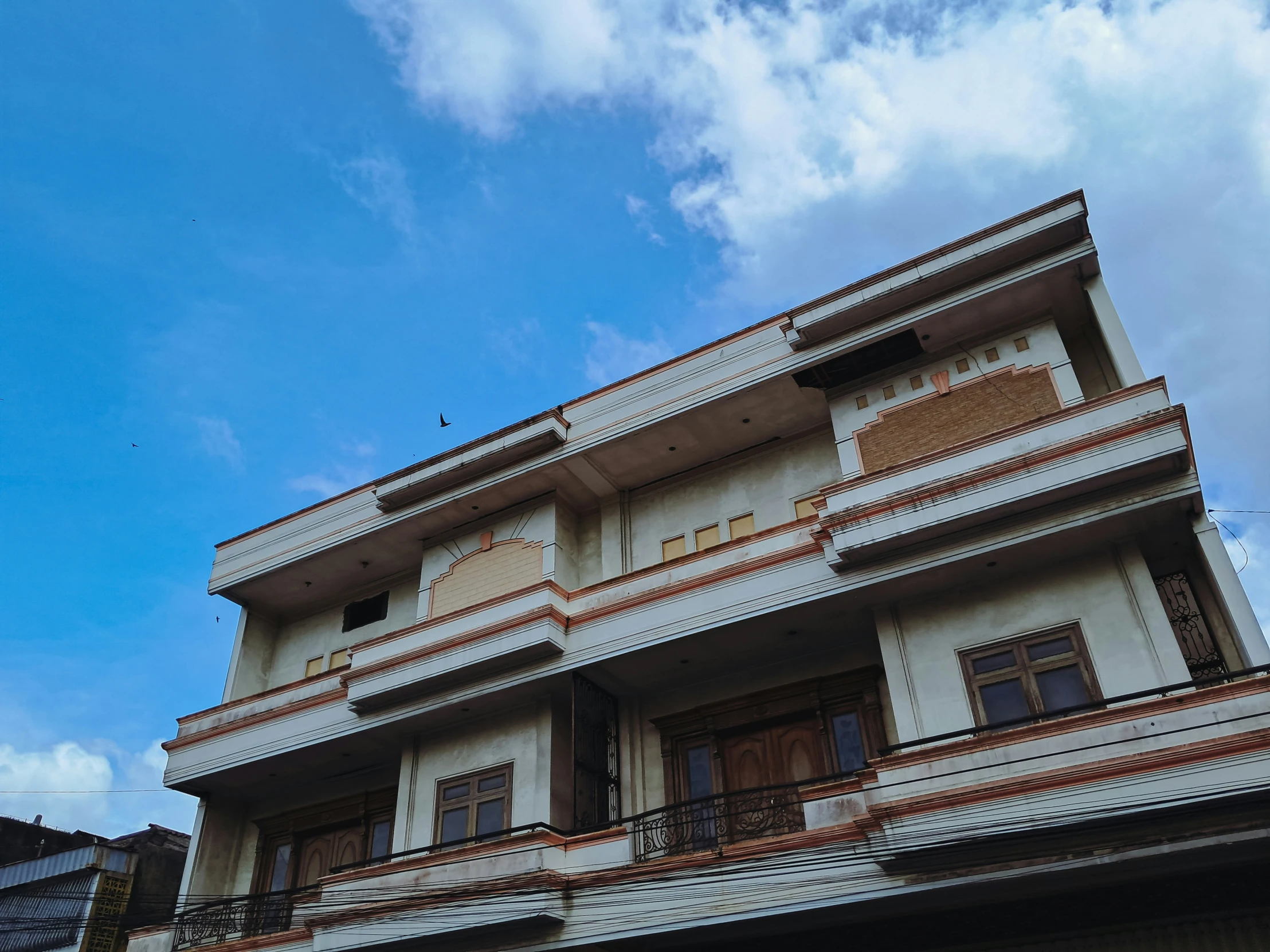 an old building with a bird sitting on top of it