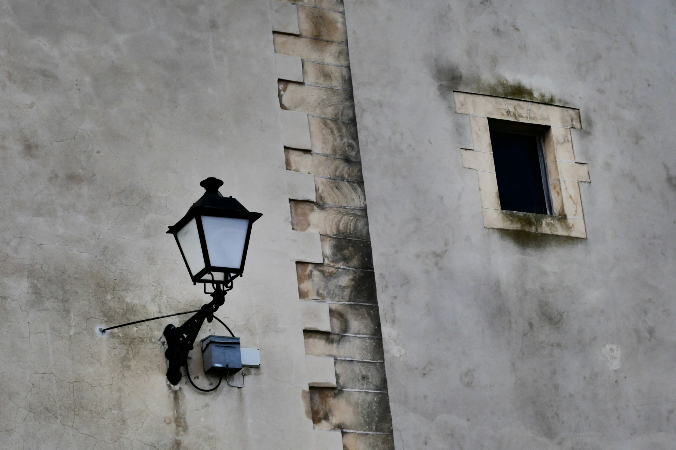 a wall light attached to the side of a building