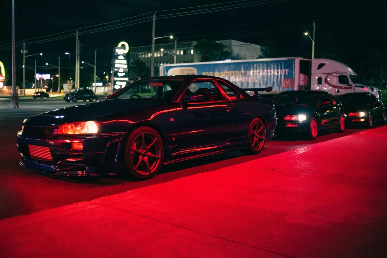 two black cars parked on the side of the road