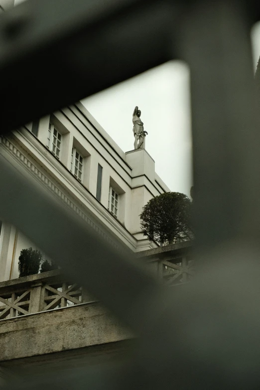 a clock tower reflected on the side of a building