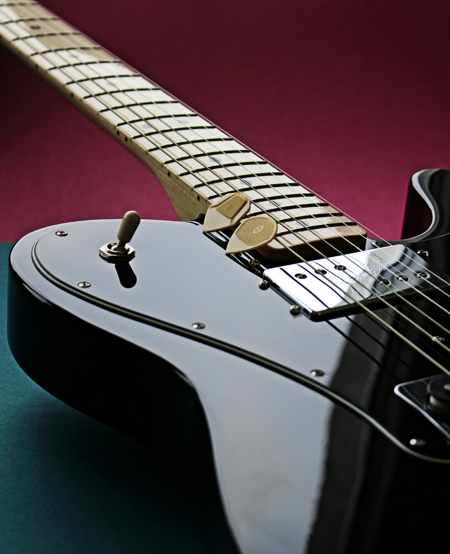 a close up of the neck and pickup on a guitar