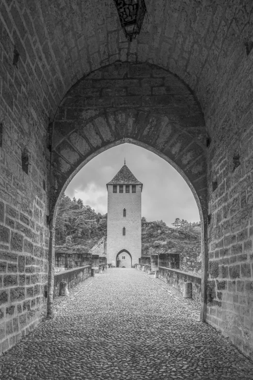 the old brick tower is at the end of an empty path