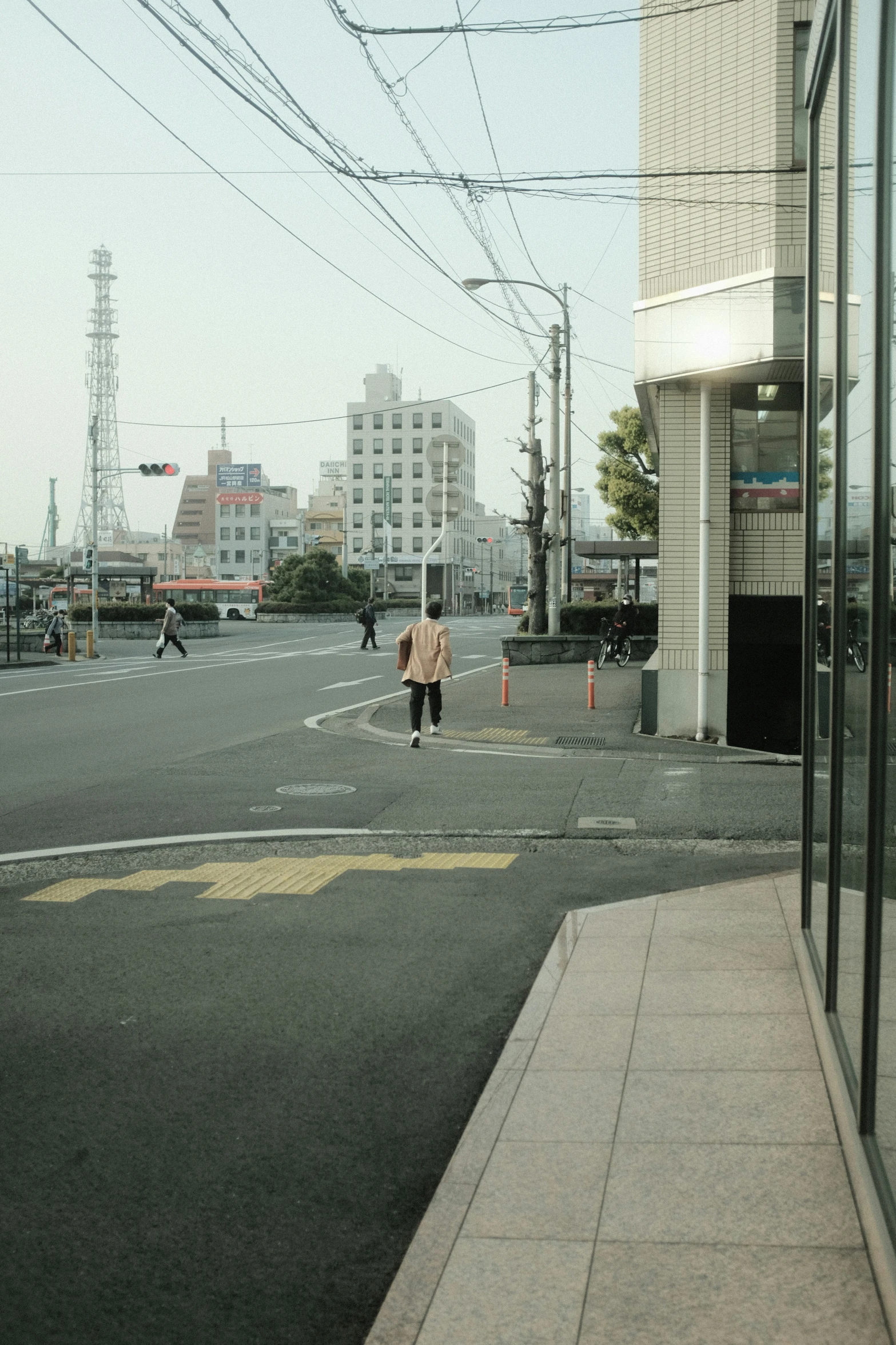 an intersection with a person walking in the middle