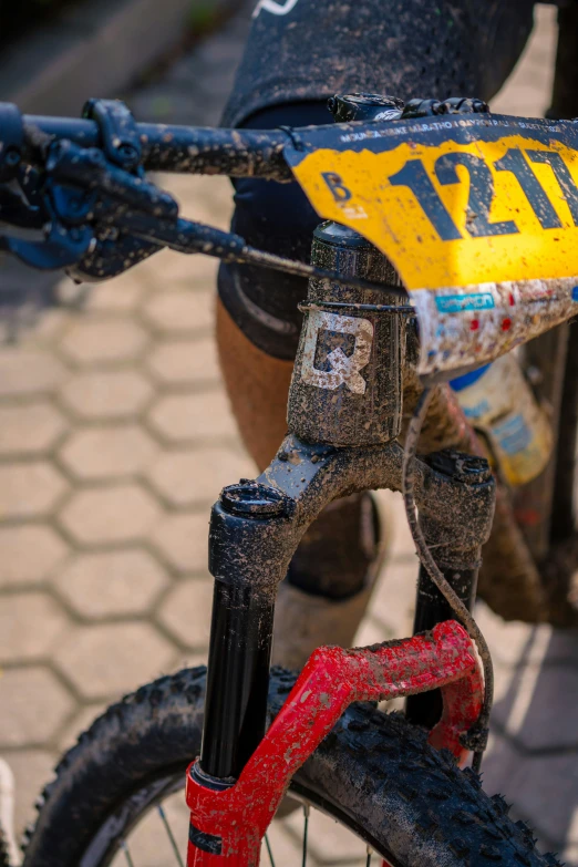 a bike with the number 11 on it, with rust and rivets