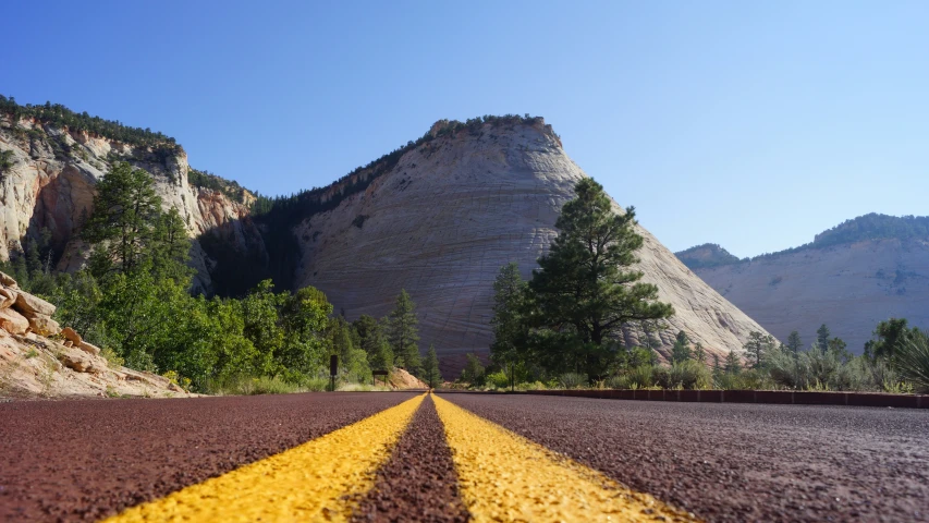 the road is empty except for one way signs