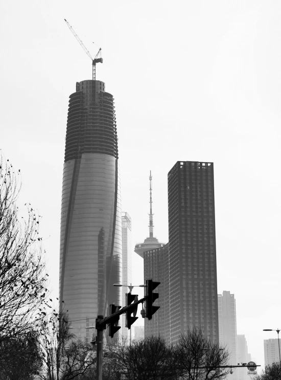 the street light is not red, so there are buildings in the background