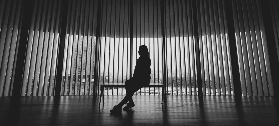 a person sitting on top of a bench