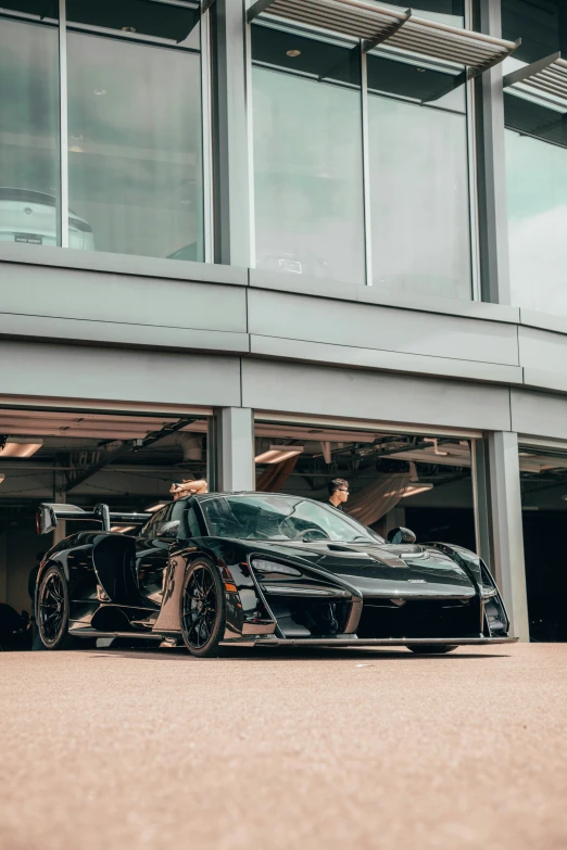 the sports car is parked in front of the store