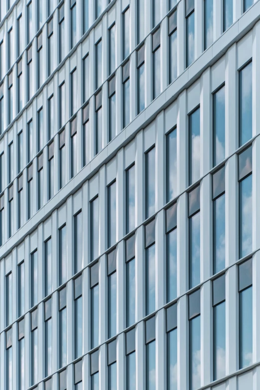 an office building with blue bricked up windows