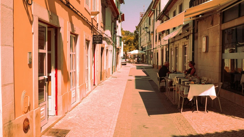 an image of people sitting outside the restaurant on their lunch break