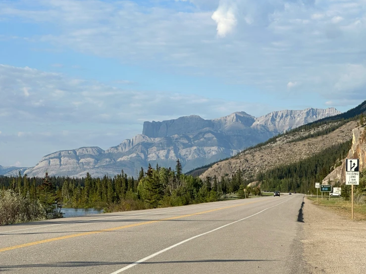 a road that is very wide in the middle of the mountains