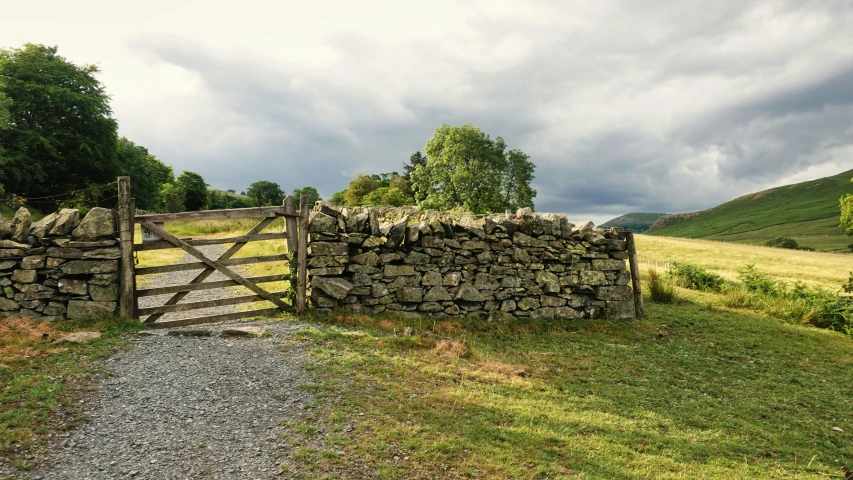 the stone wall and gate are very nice