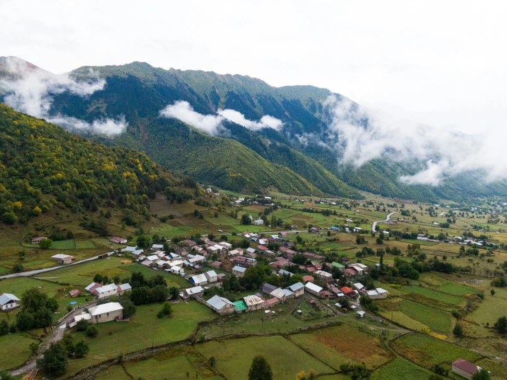 aerial view of a village in the mountains in fog