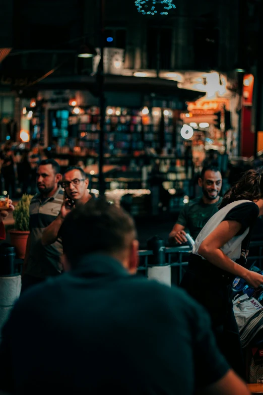 a group of people gathered outside of a store