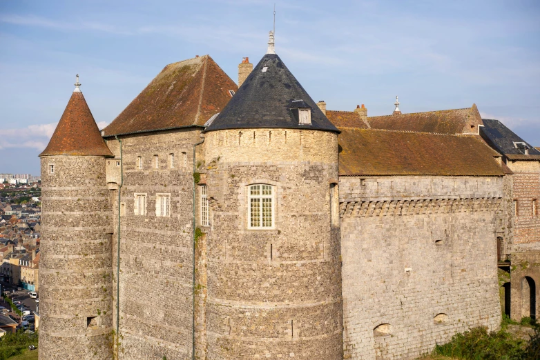 a castle on top of a mountain overlooking the town