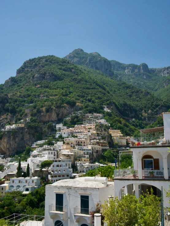 a view of the city of positi with mountains in the background