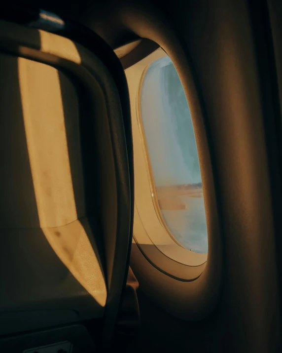 the window on the airplane's interior has a view of water