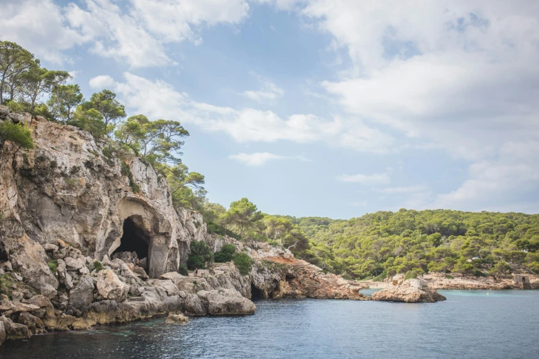 a cave is shown in the middle of a rock formation