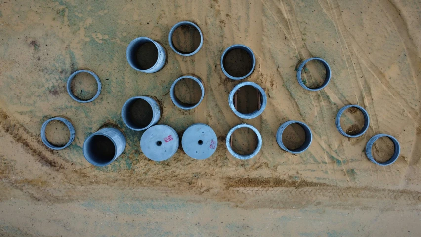 the little blue pots are lined up on the ground