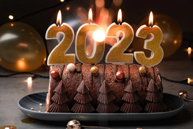 a brown cake with candles that say twenty two