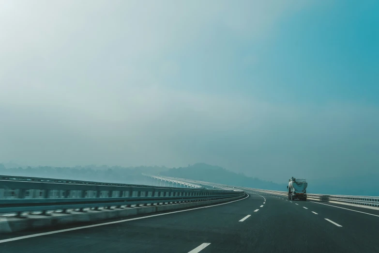 the motorist rides his motorcycle on the road