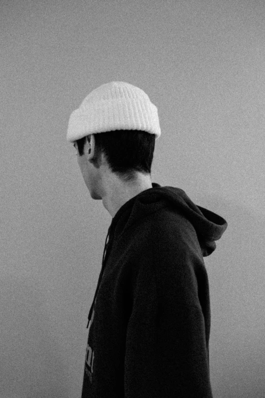 black and white po of a man with a hat