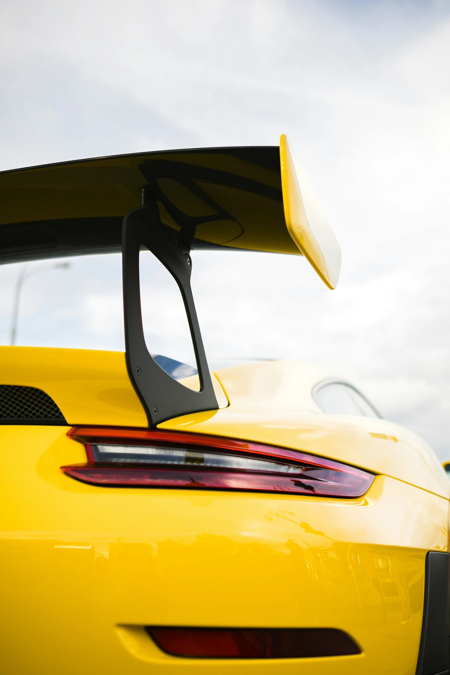 the rear end of a sports car, featuring its wingtips