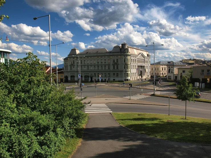 a road and parking area in front of some buildings