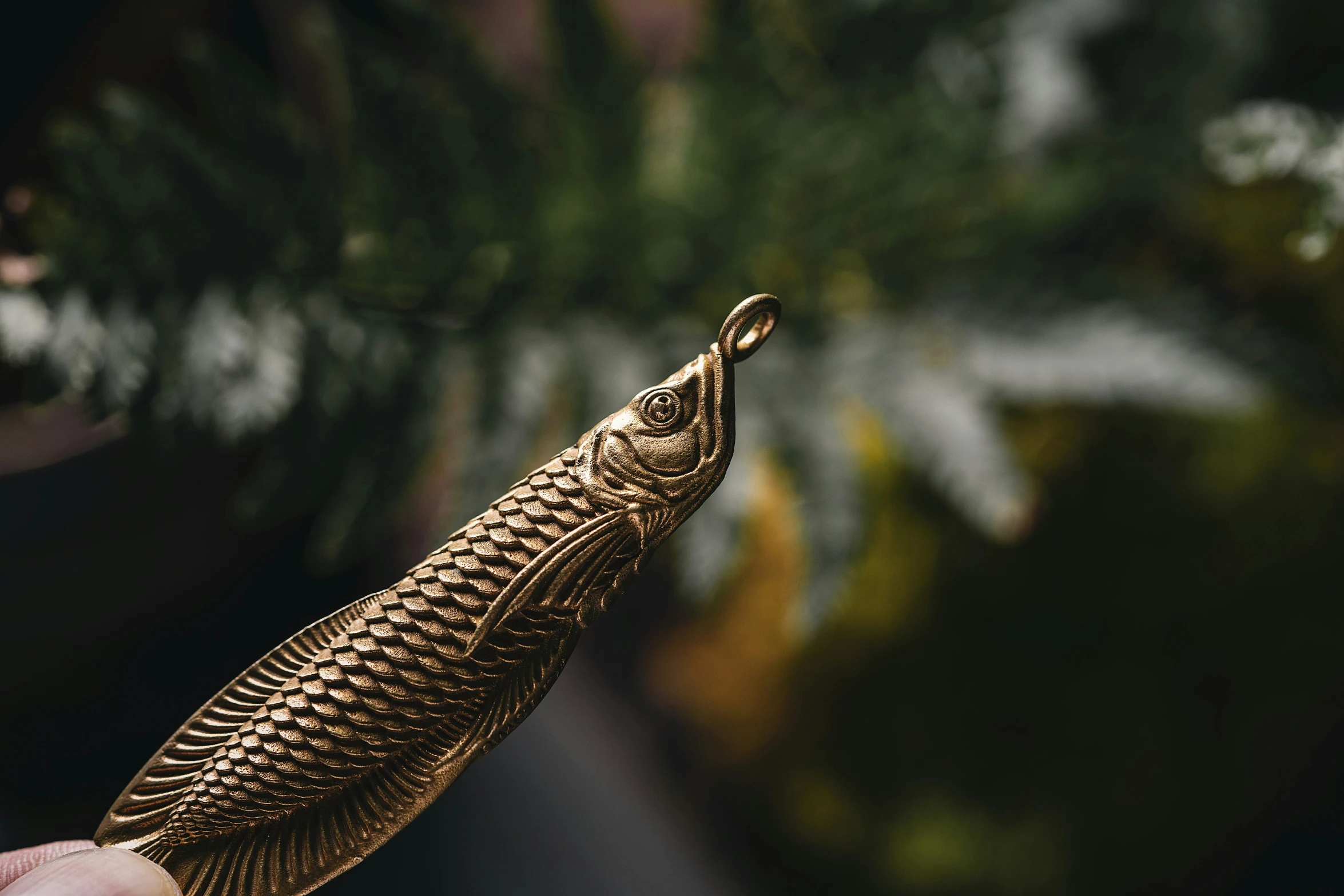 a leafy item held in a hand