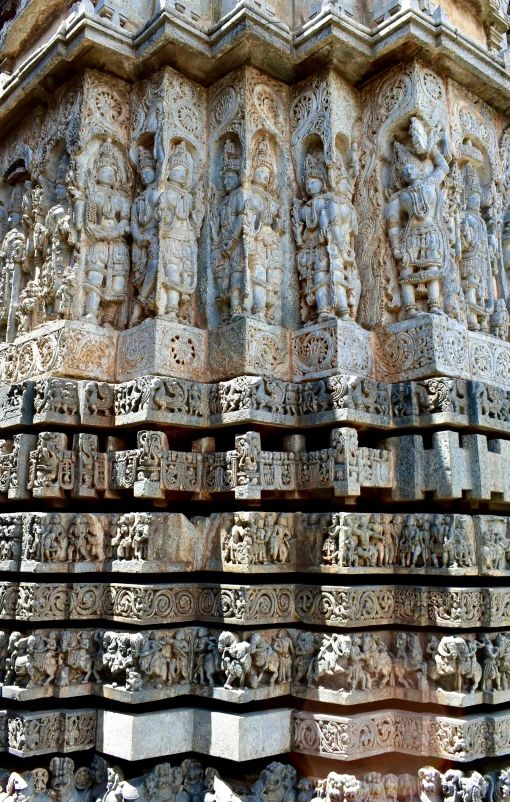 a very large structure with several carvings around it