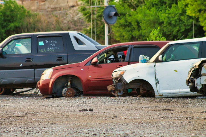 several cars and one truck in a lot