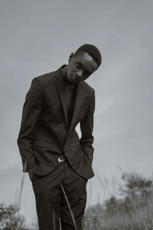 man in business suit standing alone outside