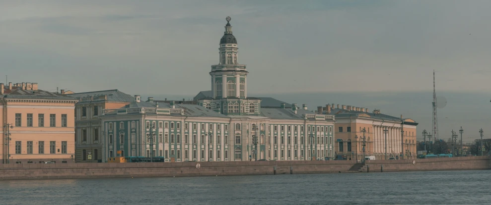 a large building on the bank of a river