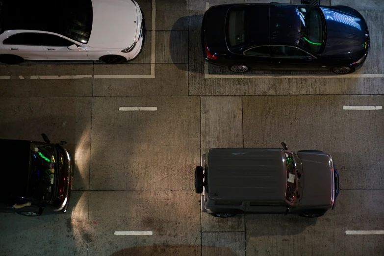 three cars are parked next to one another