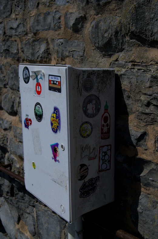 a close up of a refrigerator in front of some rocks