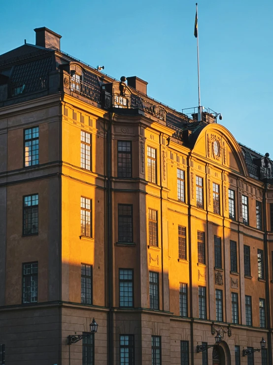 an old building with the sun shining on it