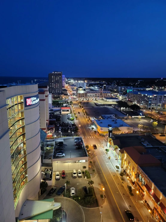 an image of a night city scene with the sun coming up