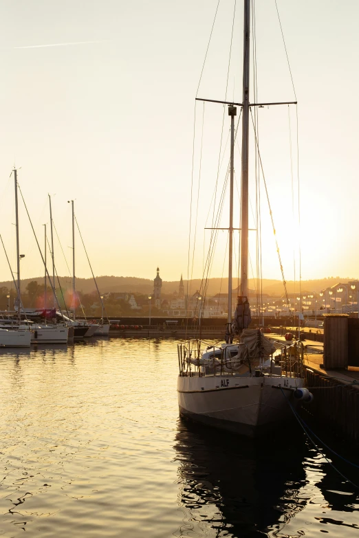 two boats are floating in the water next to some docks