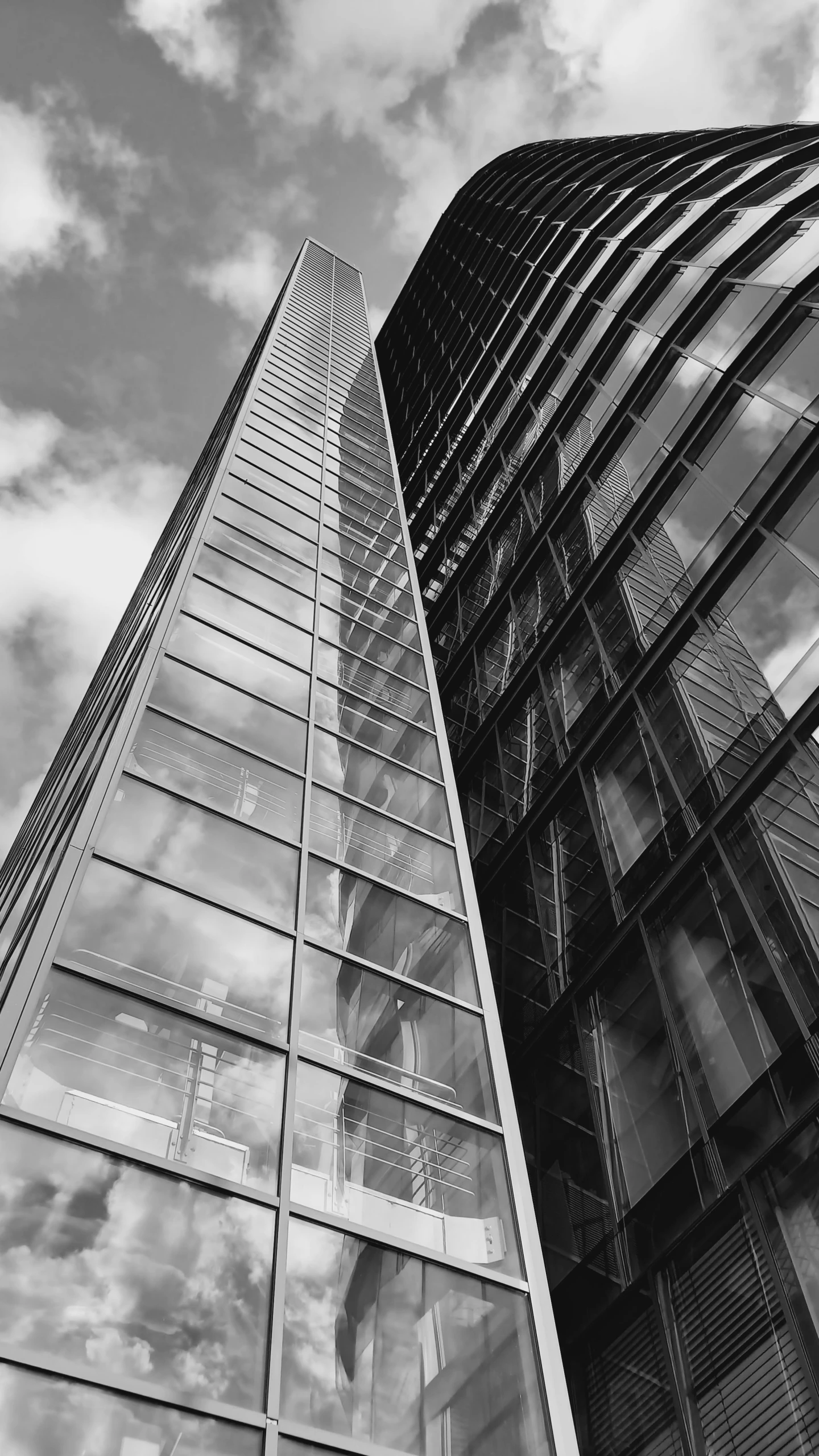 a large tall building sitting next to another tall building